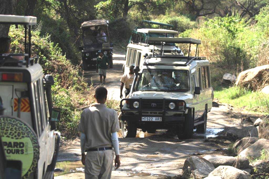Land cruiser stuck in the mud, blocking traffic