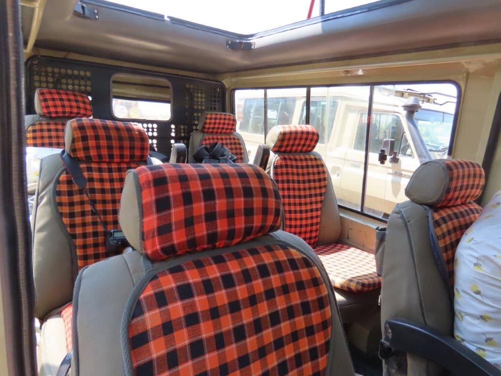 The Interior of our Safari Land Cruiser - padded seats, and lots of pillows!
