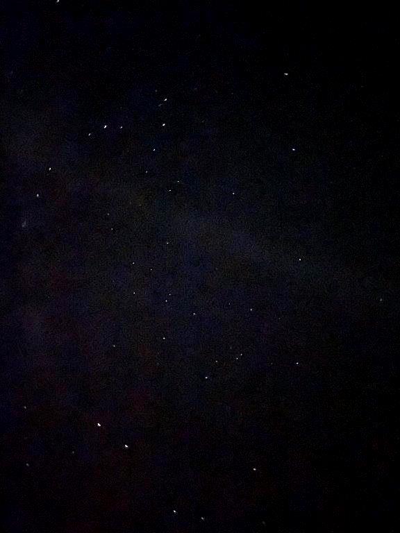 How many stars are visible in the dark sky?