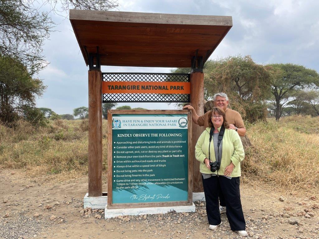 Kari & Bill at the Tarangire Park sign