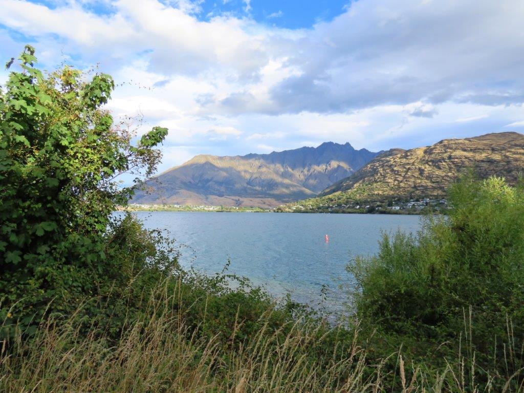 A view of the Remarkables mountain range across Lake Wakatipu from the Frankton Arm Walkway.