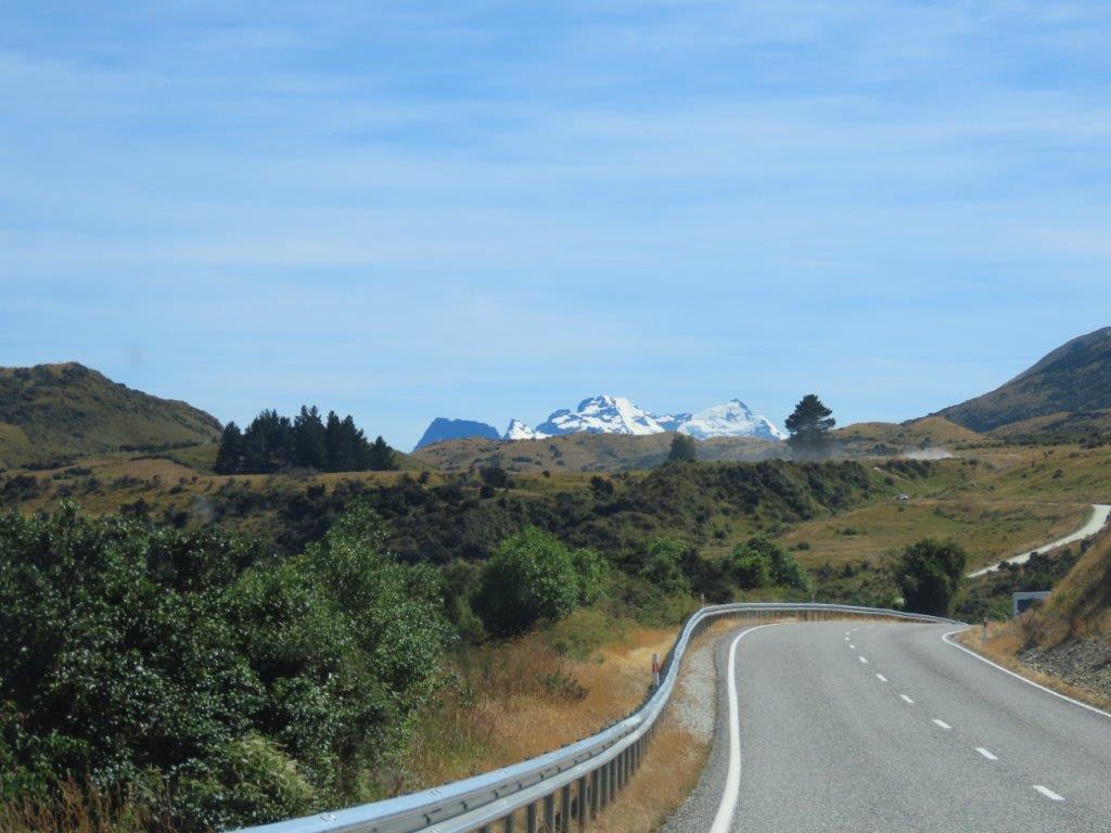 Narrow curving roads make it difficult to pass when driving in New Zealand