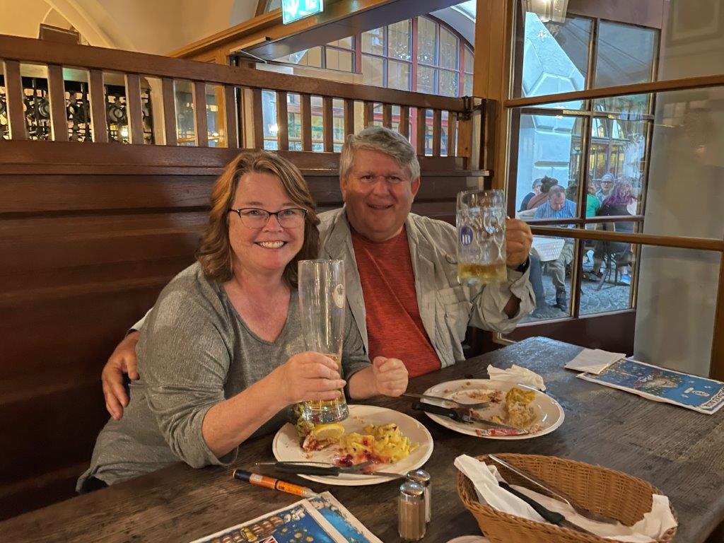 Drinking Bier and eating bratwurst at the HofBraHaus in Munich Germany