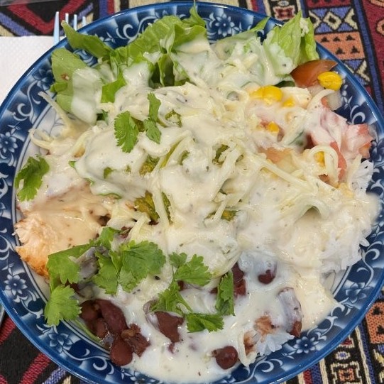 Noodles, cilantro and beans in a creamy white sauce.
