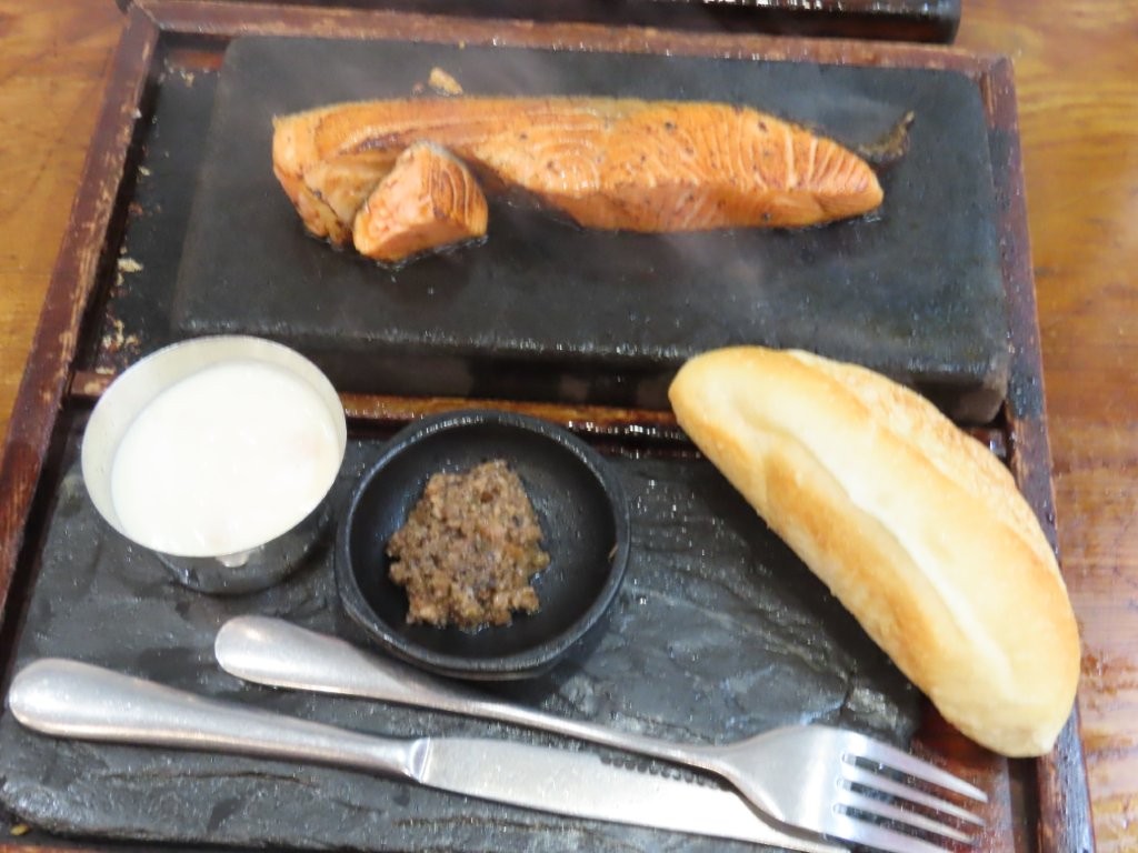 Another great example of Vietnamese Food is salmon sizzling a hot stone, to be eaten with pate, a baguette and a creamy white sauce.
