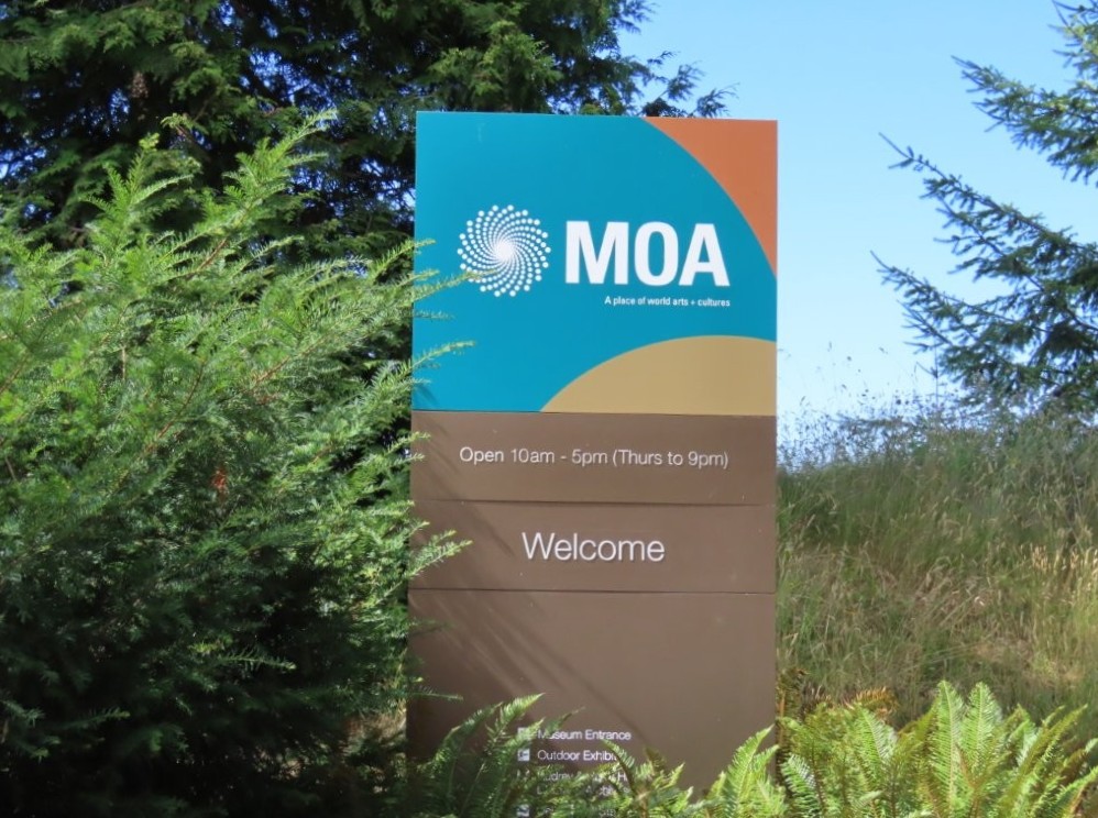 A colorful sign indicates the entrance for the Museum of Anthropology, just outside of Vancouver, BC