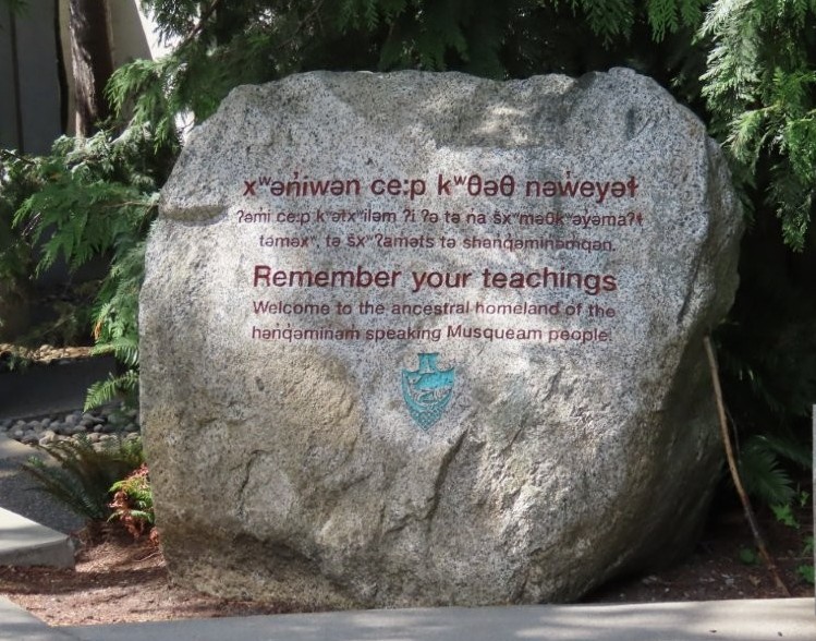 An engraved boulder welcomes visitors to the ancestral homeland of the Musqueam people.