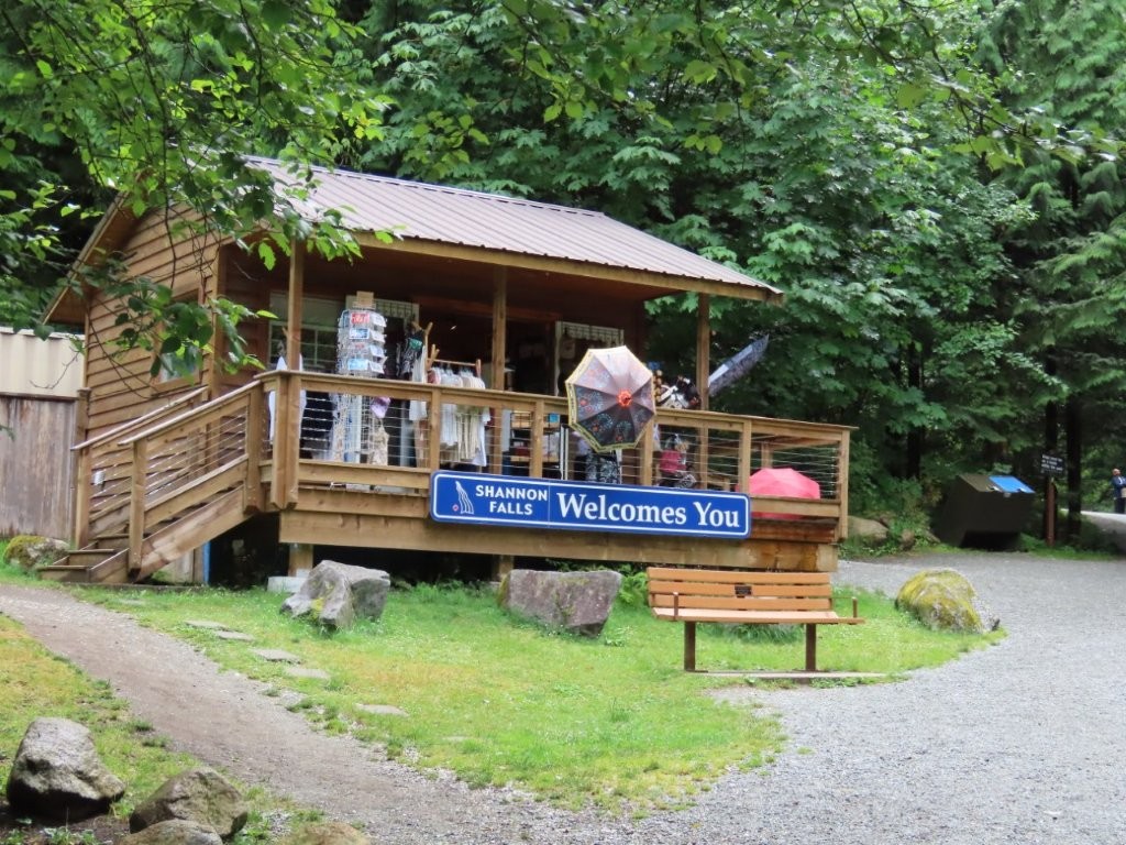 A wooden building houses the Info Center and Gift shop for Shannon Falls in British Columbia.