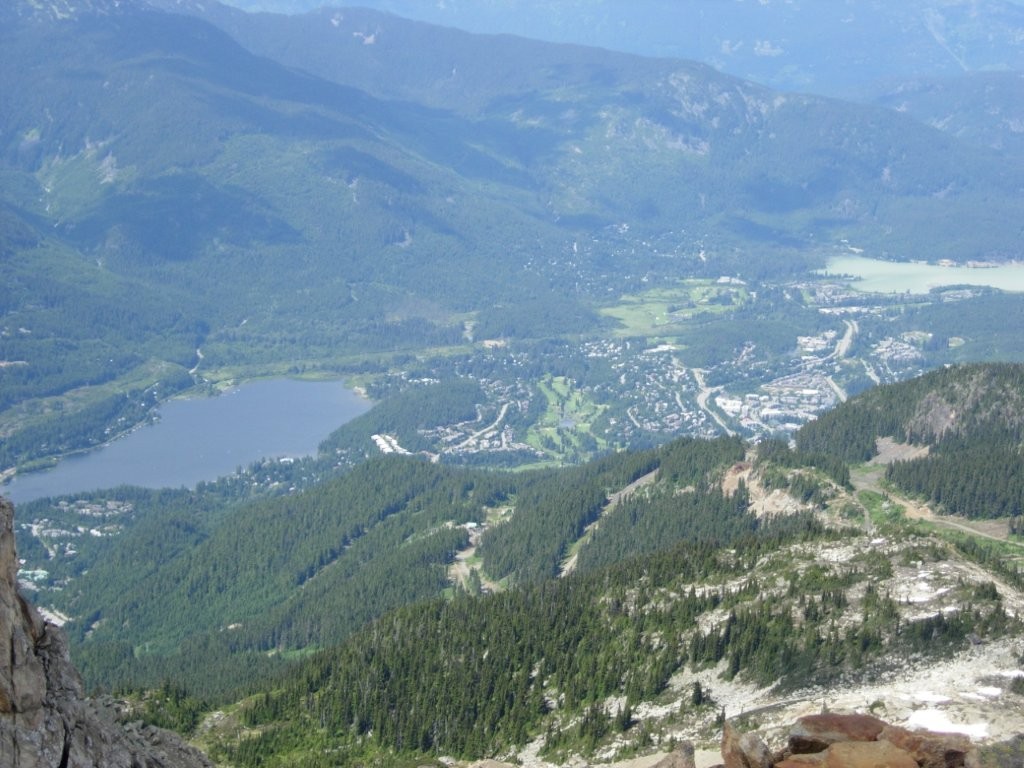 A view of the valley from the top of the mountain shows the town of Whistler BC in the distance.