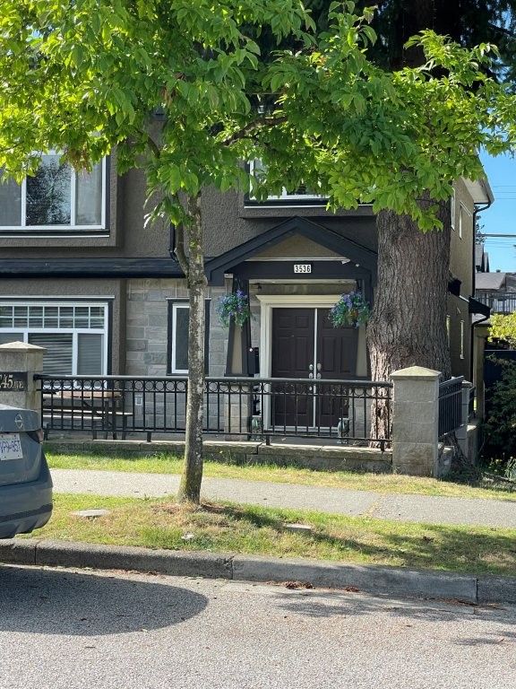 Exterior of a private ground-level suite in Vancouver, a budget stay with a full kitchen and king bed for extended visits.