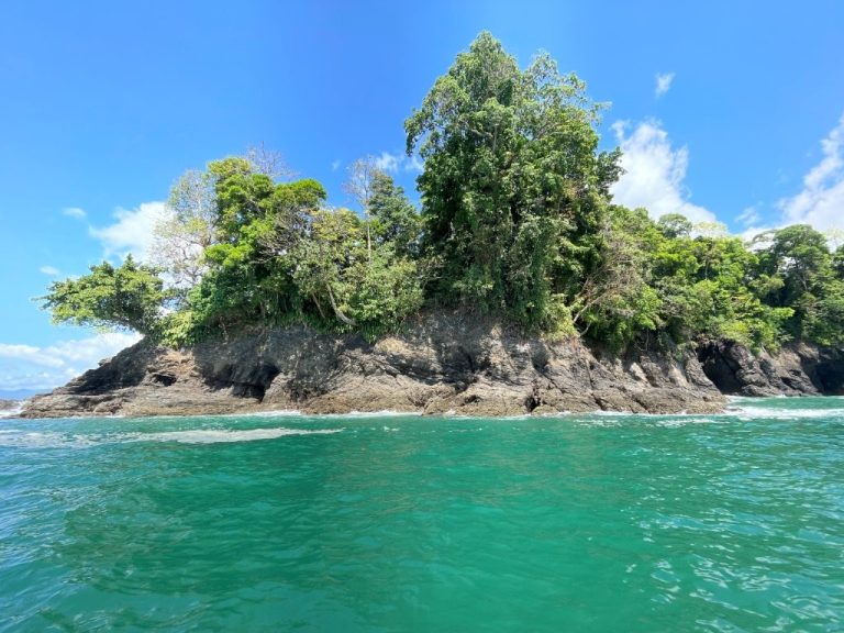 Lush rocky island surrounded by turquoise water. near Uvita Costa Rica