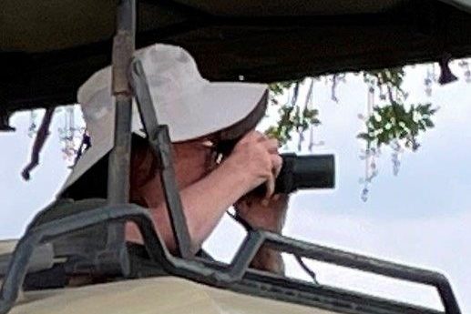 Kari shooting her camera out the roof of the Safari Land Cruiser in Tanzania