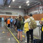 Passengers wait in a long line inside Baltra Airport after landing in the Galapagos Islands. Even after your flight arrives, there are still entry fees, passport checks, and screening steps before the trip really begins.