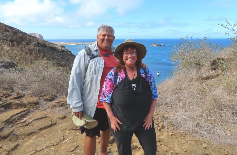 Bill and Kari rest at the Punta Pitt viewpoint after the challenging climb to the top.