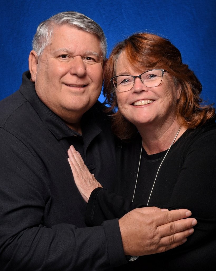 Kari and Bill pose together dressed for formal night. Most guests dressed somewhere between business casual and cocktail attire rather than black-tie formalwear.