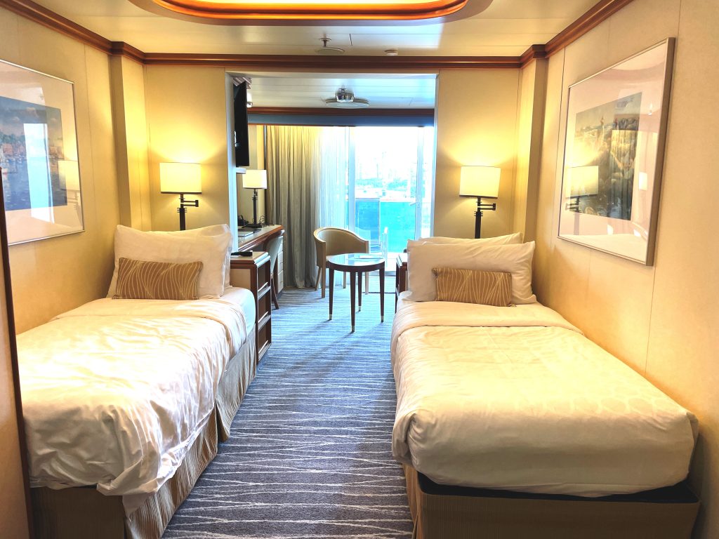 Two twin beds sit against opposite walls in our Sapphire Princess mini-suite, leaving an open walkway between them. This was the original cabin arrangement before we pushed the beds together.