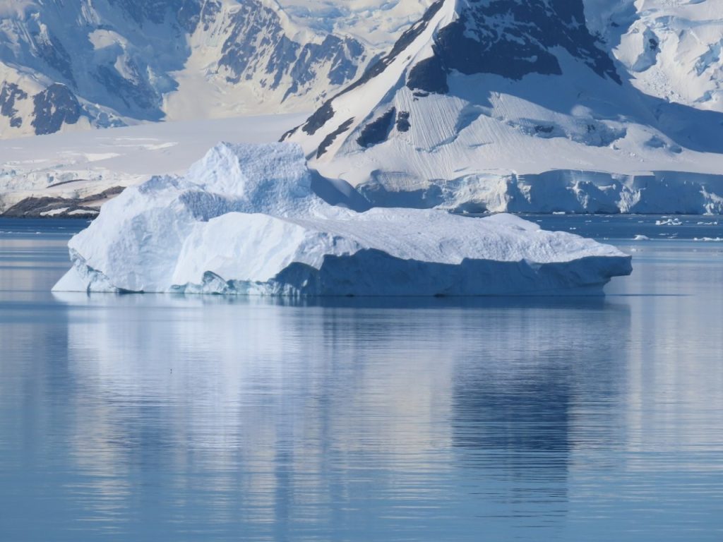 A sculpted iceberg drifts in the Antarctic Peninsula. Even during the Southern Hemisphere summer, the light and weather could change dramatically throughout the day.