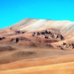 Softly colored volcanic hills and rocky outcrops roll across a seemingly endless desert horizon. The remote landscapes along Ruta 27 felt untouched and far removed from the busier attractions near town.