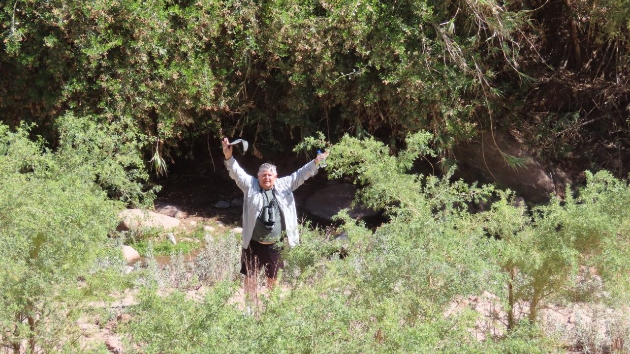 Bill waves at me from down below where he was walking along the river bed.