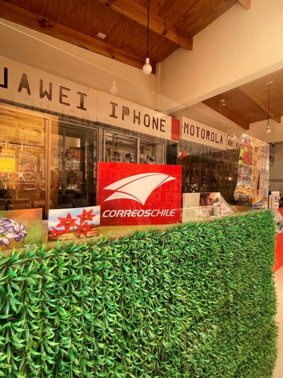 A small postal counter inside a local shop displays the logo of Chile's postal service. Travelers looking to mail postcards or packages can find postal services within San Pedro de Atacama.