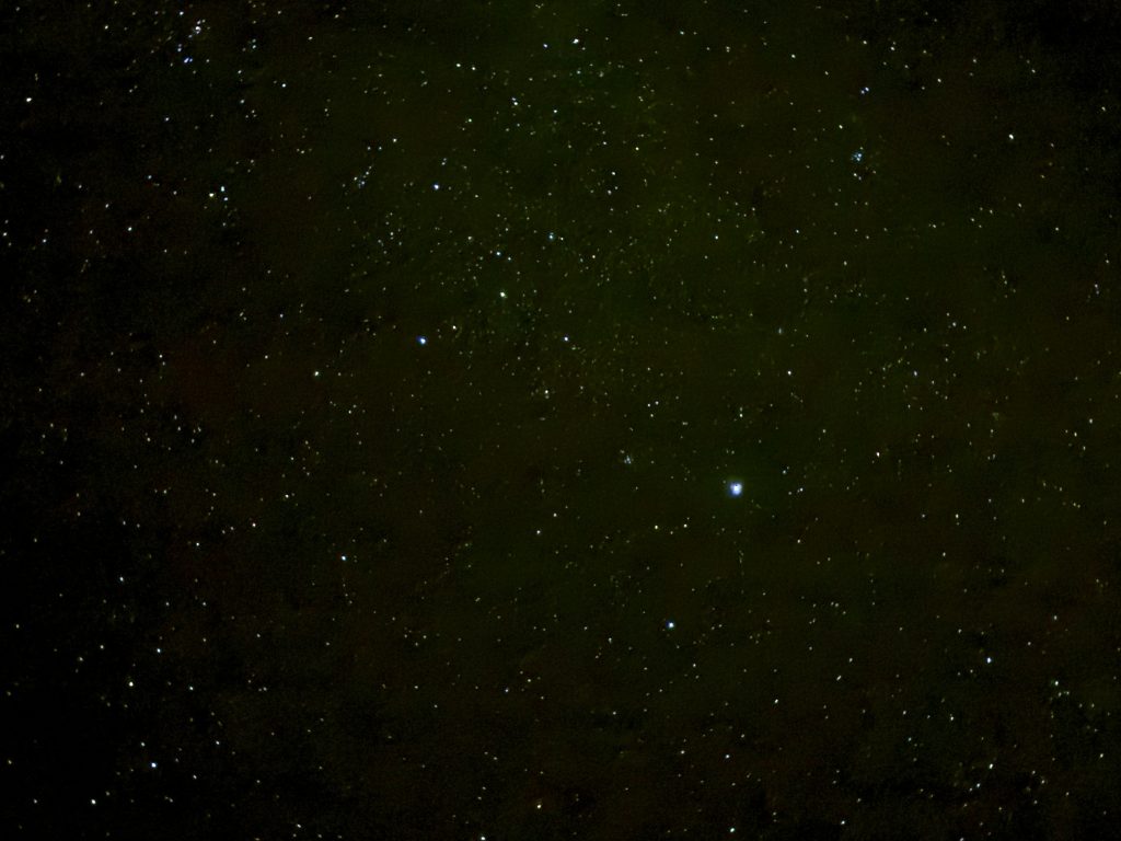 Bright stars shine against the dark desert sky during an evening of DIY stargazing. Even simple smartphone photos become lasting travel memories.