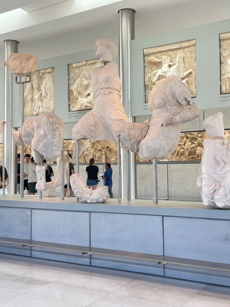 Ancient marble sculptures and carved reliefs are displayed inside the bright, modern Acropolis Museum. Visiting the museum with our guide added another layer to what we had just seen outside—and gave us a welcome break from the heat.