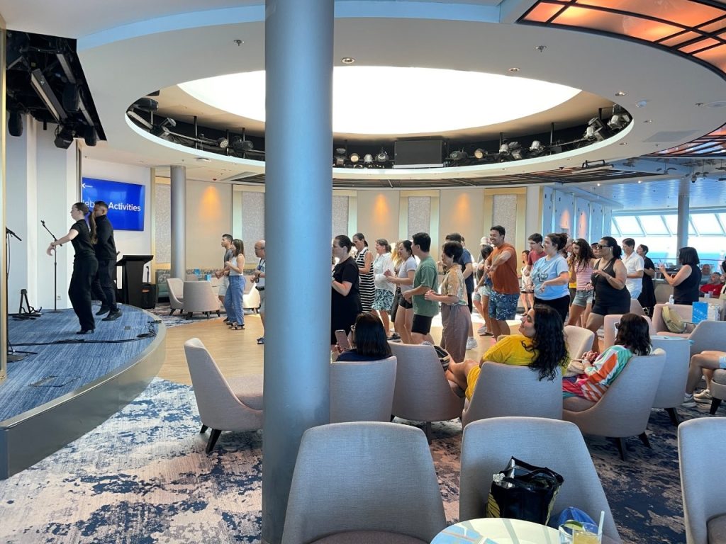 Passengers gather together for an organized activity aboard Celebrity Infinity. Dance classes, trivia, games and other activities meant there was plenty happening onboard, particularly during our two sea days.