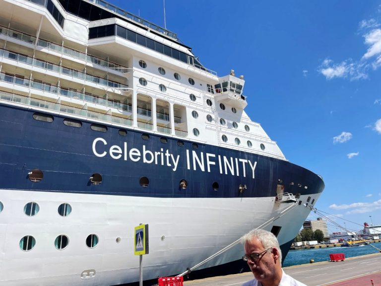 Celebrity Infinity sits docked beneath a clear blue sky, its white hull and dark upper decks rising above the water. This firsthand view introduces our Celebrity Infinity review and the ship that carried us through Greece and Turkey.