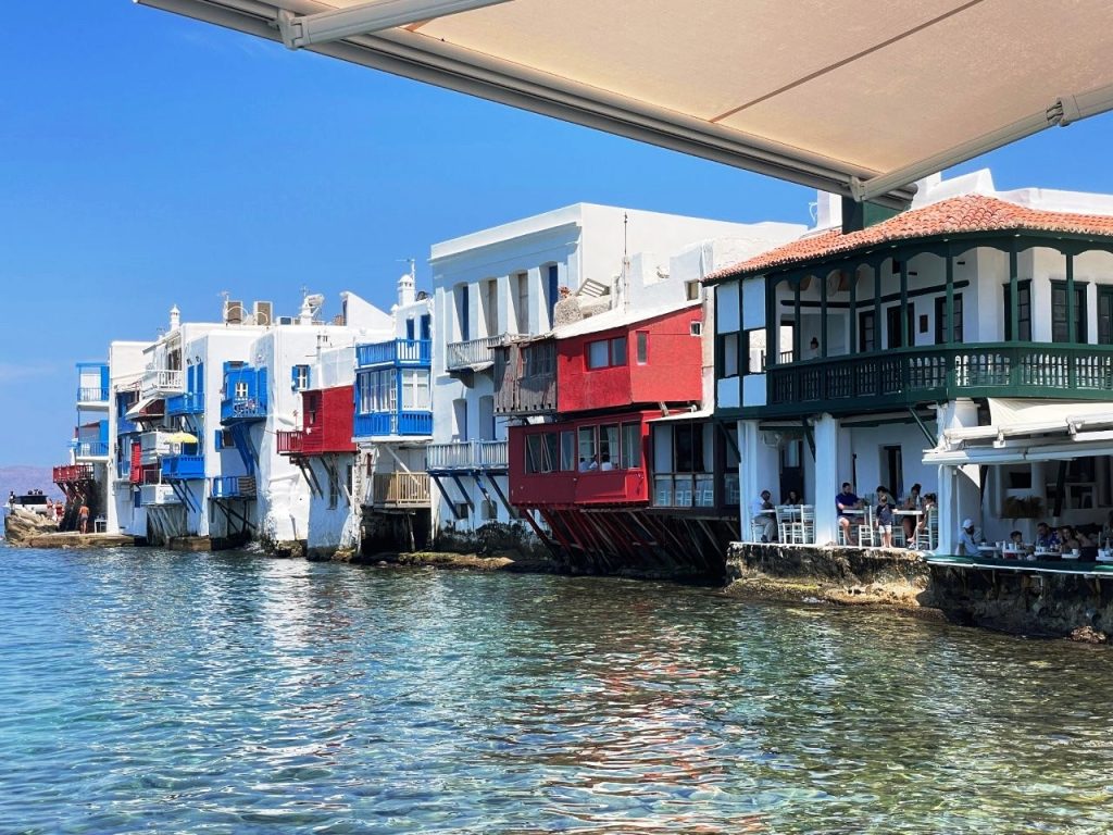 Colorful balconies jut from whitewashed buildings along the rocky waterfront of Little Venice in Mykonos. This easy-to-explore port delivered some of the most photogenic scenery of our Celebrity Infinity Greece cruise.