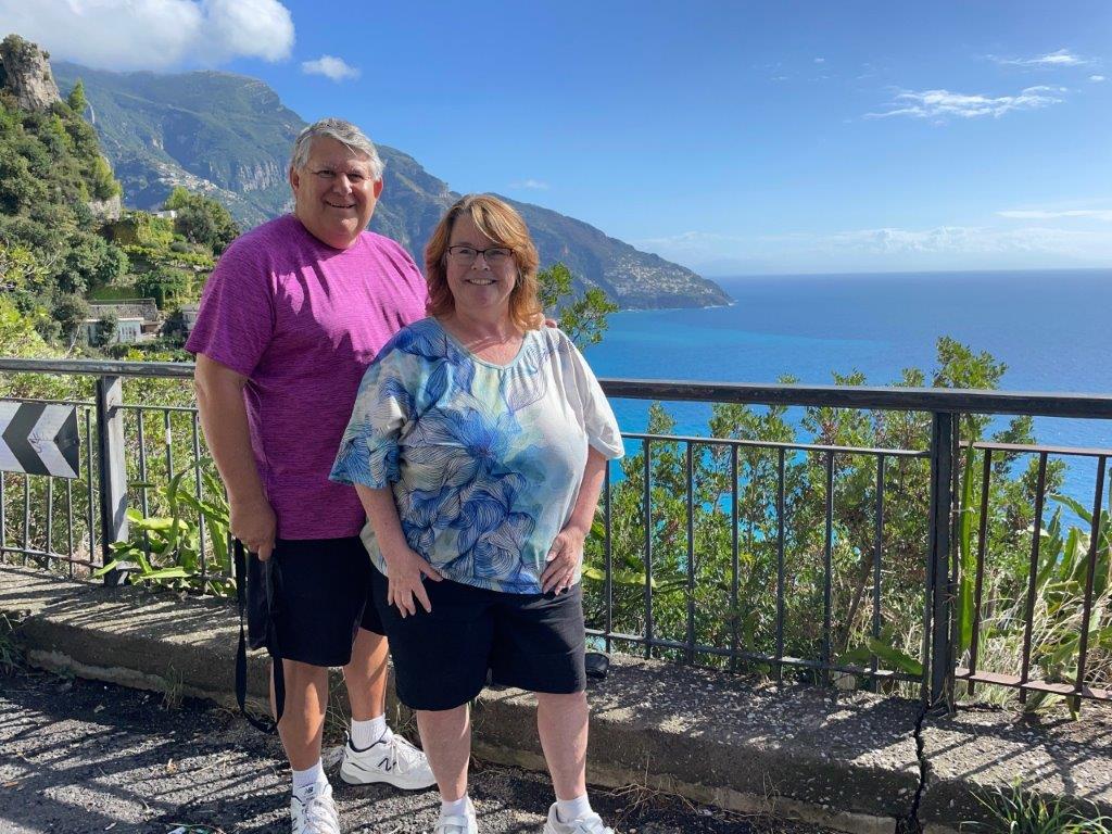 Bill and Kari are visiting the Amalfi Coast of Italy with it's rugged coastline and bright blue waters of the Mediterranean behind them.
